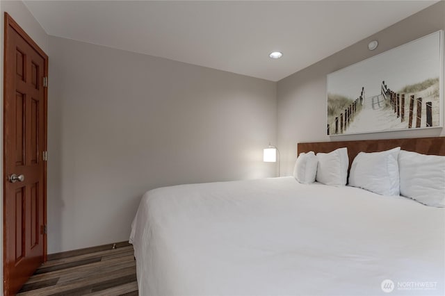 bedroom featuring wood finished floors and recessed lighting