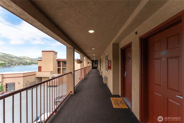 balcony featuring a water view