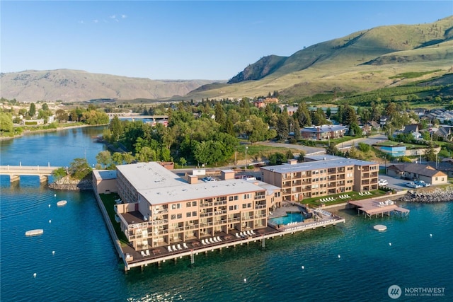 drone / aerial view of a water and mountain view