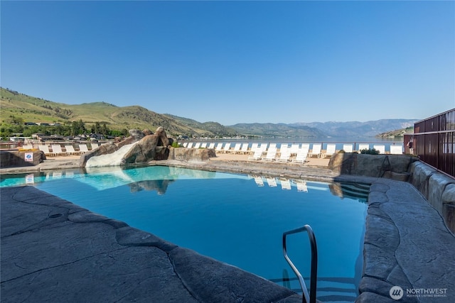 community pool featuring a mountain view