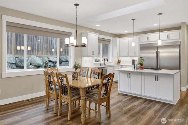 6068 Monument Dr, Ferndale, WA 98248 - dining room featuring a chandelier, dark wood finished floors, baseboards, and recessed lighting