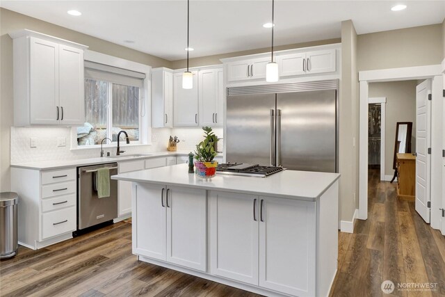 6068 Monument Dr, Ferndale, WA 98248 - kitchen featuring stainless steel appliances, a sink, white cabinetry, light countertops, and recessed lighting