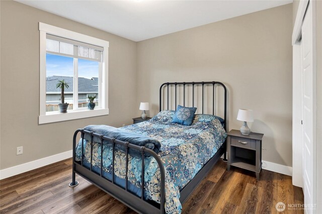 6068 Monument Dr, Ferndale, WA 98248 - bedroom featuring baseboards and wood finished floors