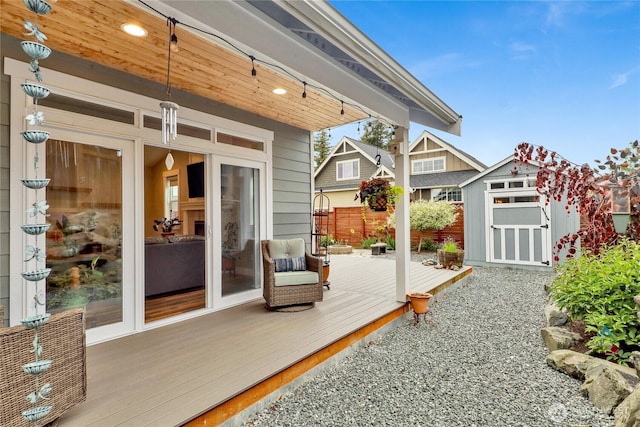 6068 Monument Dr, Ferndale, WA 98248 - wooden terrace with a storage unit, an outbuilding, and fence