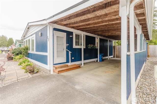 1101 S Scheuber Rd # 27, Centralia, WA 98531 - view of side of property with fence, driveway, a carport, and entry steps
