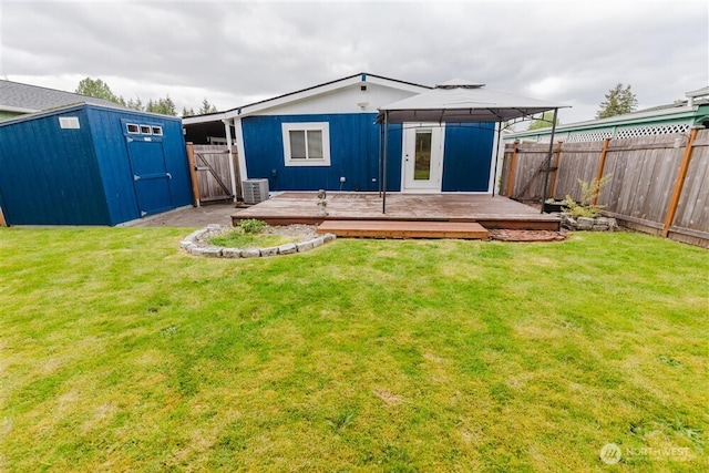 1101 S Scheuber Rd # 27, Centralia, WA 98531 - rear view of house featuring a gazebo, cooling unit, a deck, an outdoor structure, and a storage unit