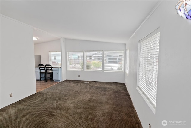 1101 S Scheuber Rd # 27, Centralia, WA 98531 - unfurnished living room featuring lofted ceiling and carpet floors