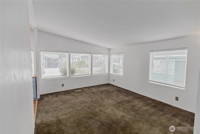 1101 S Scheuber Rd # 27, Centralia, WA 98531 - spare room featuring carpet flooring and lofted ceiling