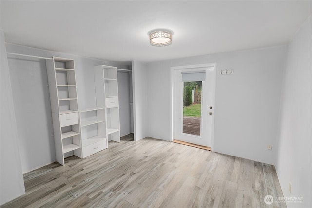 1101 S Scheuber Rd # 27, Centralia, WA 98531 - unfurnished bedroom with wood finished floors and access to outside