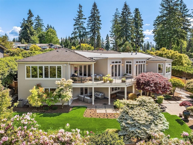 9234 NE 25th St, Clyde Hill, WA 98004 - back of house with a patio area, a wooden deck, a yard, and french doors