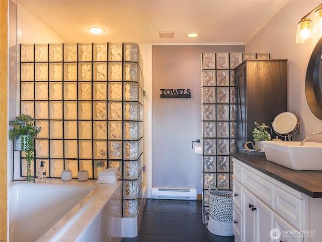 bathroom with baseboard heating, tiled tub, ornamental molding, tile patterned floors, and vanity