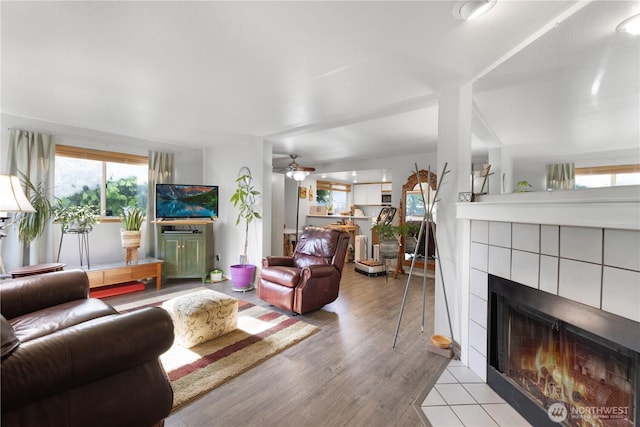 701 5th Ave S Unit C105, Kent, WA 98032 - living area with a fireplace, wood finished floors, and ceiling fan