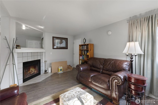 701 5th Ave S Unit C105, Kent, WA 98032 - living area featuring wood finished floors and a fireplace