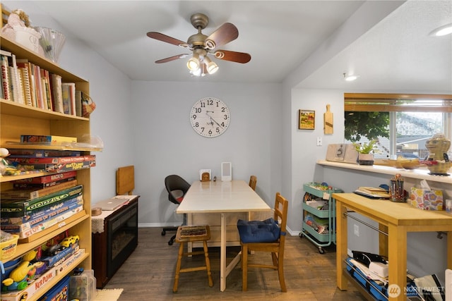 701 5th Ave S Unit C105, Kent, WA 98032 - dining area with ceiling fan, dark wood-style flooring, and baseboards