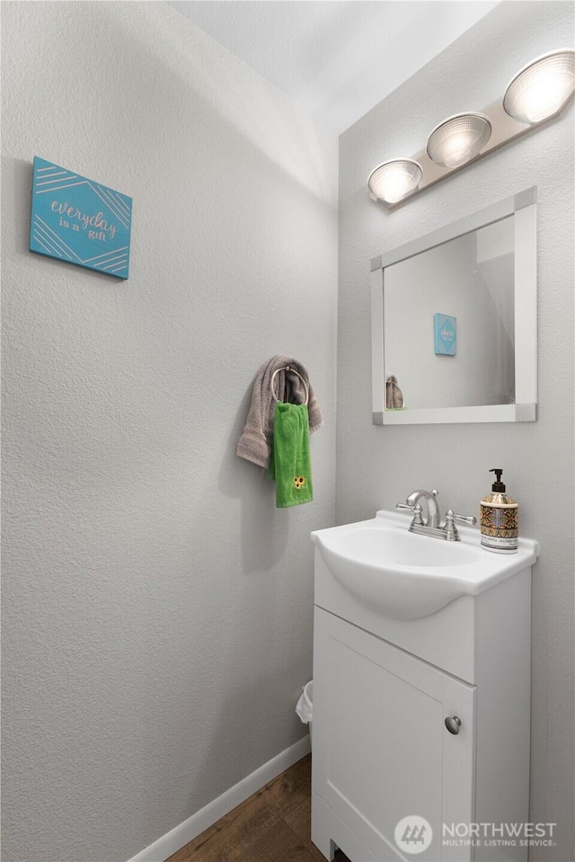 701 5th Ave S Unit C105, Kent, WA 98032 - bathroom with wood finished floors, vanity, and baseboards