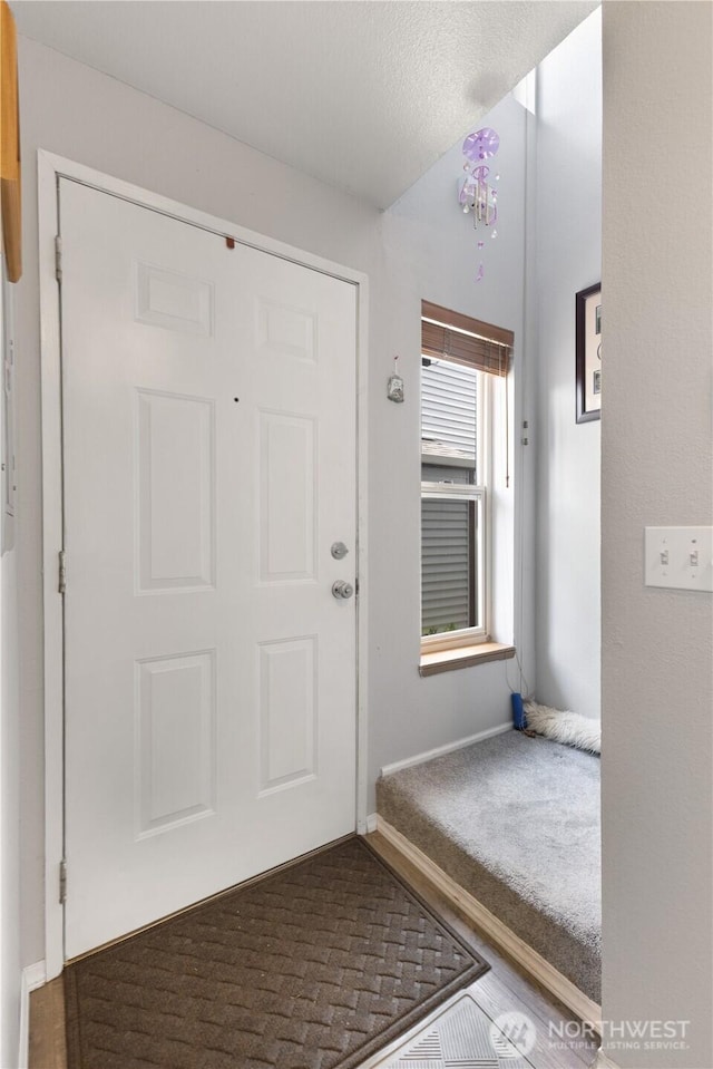 701 5th Ave S Unit C105, Kent, WA 98032 - entrance foyer featuring carpet floors and baseboards