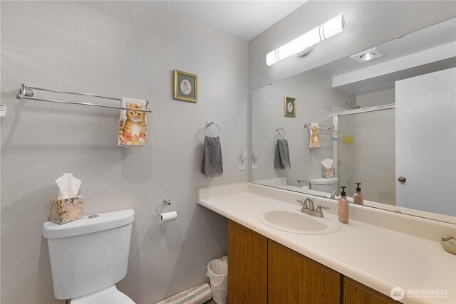 701 5th Ave S Unit C105, Kent, WA 98032 - full bathroom featuring toilet, a shower stall, and vanity