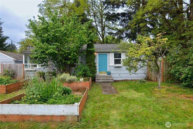 1917 NE 143rd St, Seattle, WA 98125 - obstructed view of property featuring a garden