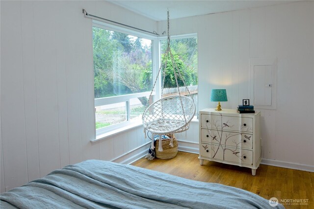 1917 NE 143rd St, Seattle, WA 98125 - bedroom with multiple windows, wood finished floors, and baseboards