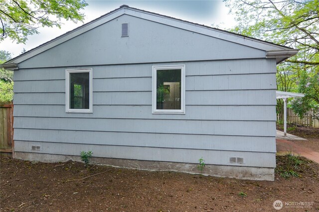 1917 NE 143rd St, Seattle, WA 98125 - view of home's exterior with crawl space and fence