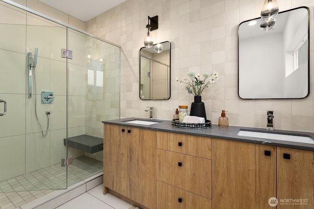 8333 14th Ave NW Unit A, Seattle, WA 98117 - full bathroom featuring tile walls, backsplash, a stall shower, tile patterned floors, and double vanity