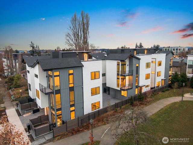 8333 14th Ave NW Unit A, Seattle, WA 98117 - property at dusk featuring fence and a residential view
