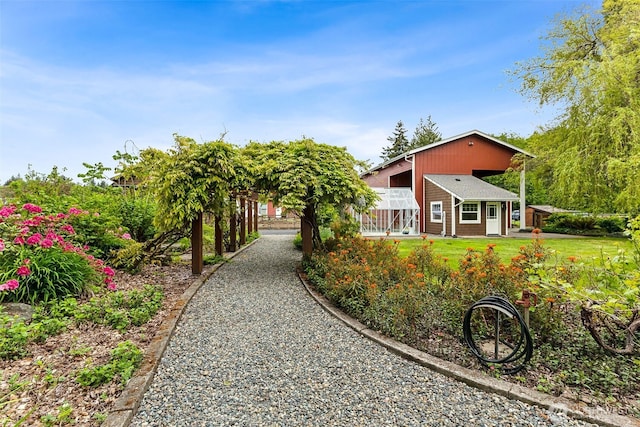 view of property exterior featuring a lawn