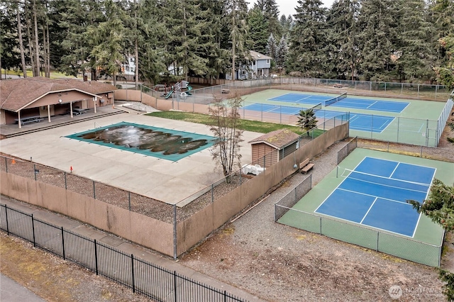 8612 165th Street Ct E, Puyallup, WA 98375 - view of swimming pool featuring a tennis court and fence