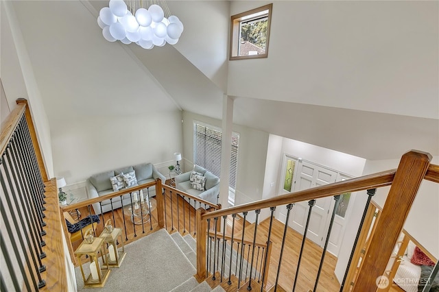 8612 165th Street Ct E, Puyallup, WA 98375 - staircase featuring high vaulted ceiling and wood finished floors
