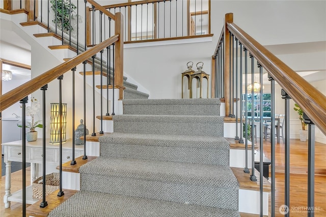 8612 165th Street Ct E, Puyallup, WA 98375 - stairway featuring wood finished floors and a high ceiling