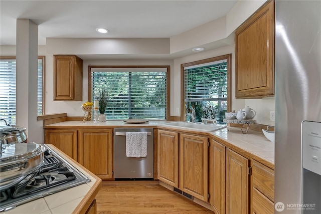 8612 165th Street Ct E, Puyallup, WA 98375 - kitchen with appliances with stainless steel finishes, tile counters, a sink, healthy amount of natural light, and recessed lighting