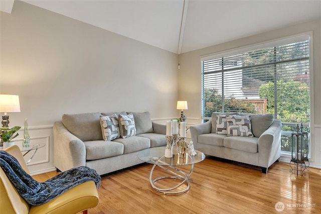 8612 165th Street Ct E, Puyallup, WA 98375 - living room featuring vaulted ceiling and wood finished floors