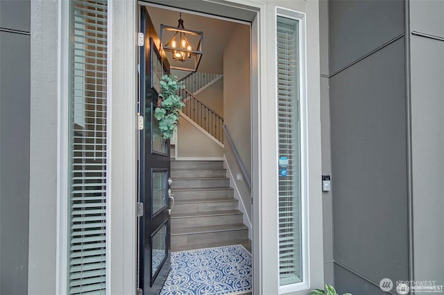 7223 NE 118th Ct, Kirkland, WA 98034 - stairs featuring a chandelier
