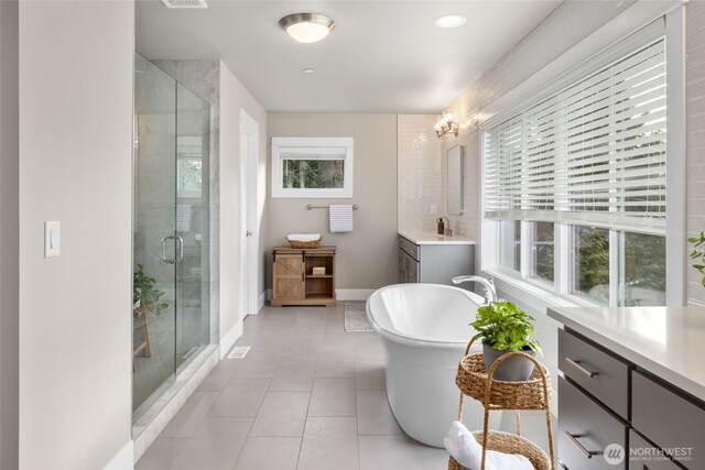 7223 NE 118th Ct, Kirkland, WA 98034 - bathroom featuring vanity, a stall shower, tile patterned floors, and baseboards