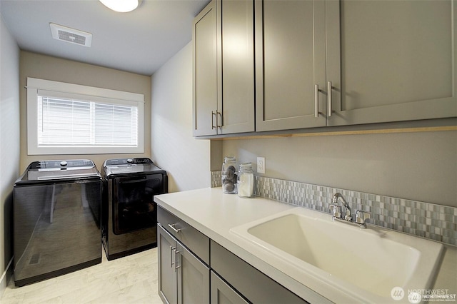 7223 NE 118th Ct, Kirkland, WA 98034 - clothes washing area with separate washer and dryer, cabinet space, and light marble finish floors