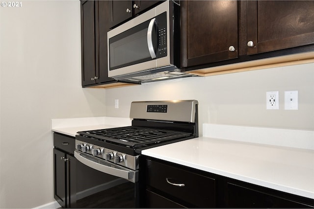 15326 NE 70th St, Vancouver, WA 98682 - kitchen featuring appliances with stainless steel finishes, light countertops, dark brown cabinetry, and baseboards
