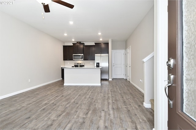 15326 NE 70th St, Vancouver, WA 98682 - kitchen with stainless steel appliances, open floor plan, light wood finished floors, light countertops, and recessed lighting