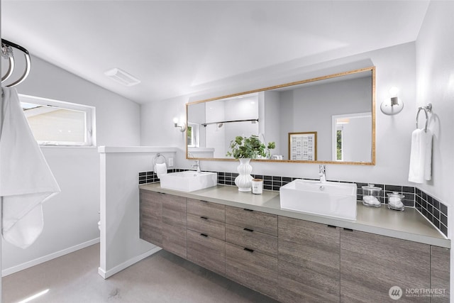 4757 Delridge Way SW, Seattle, WA 98106 - full bathroom with double vanity, plenty of natural light, concrete floors, vaulted ceiling, and toilet
