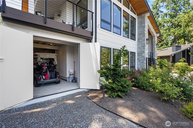 17905 NE 19th Pl, Bellevue, WA 98008 - view of property exterior featuring a balcony and stone siding