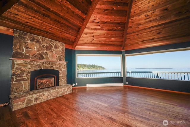585 Raccoon Point Rd, Orcas Island, WA 98245 - unfurnished living room with wood finished floors, a stone fireplace, a water view, wood ceiling, and baseboards