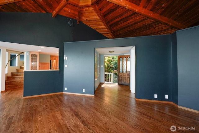 585 Raccoon Point Rd, Orcas Island, WA 98245 - unfurnished living room featuring wood ceiling, baseboards, wood finished floors, and stairs