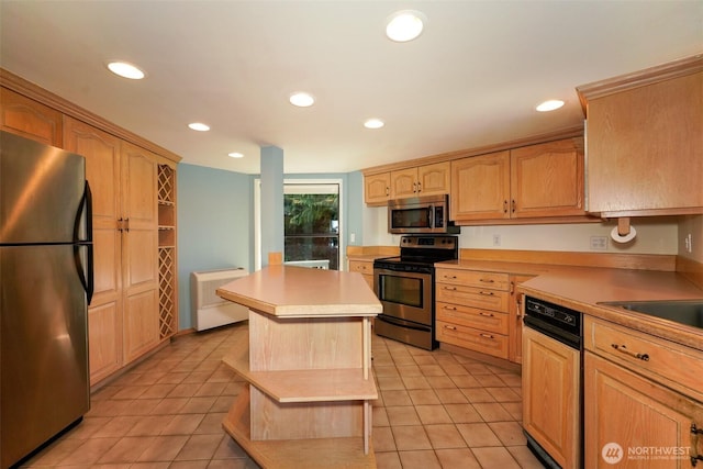 585 Raccoon Point Rd, Orcas Island, WA 98245 - kitchen featuring appliances with stainless steel finishes, light tile patterned floors, light brown cabinetry, recessed lighting, and light countertops