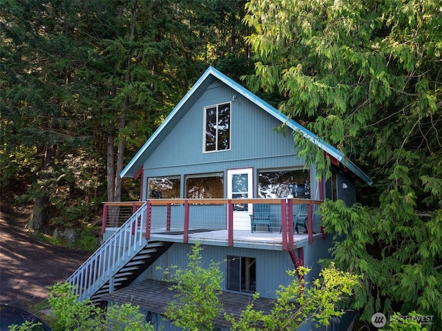 585 Raccoon Point Rd, Orcas Island, WA 98245 - rear view of house with stairway and a deck