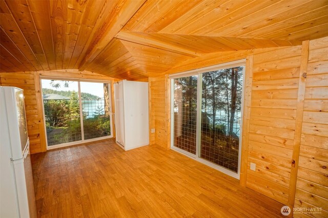 585 Raccoon Point Rd, Orcas Island, WA 98245 - unfurnished room featuring wooden ceiling, lofted ceiling, wood finished floors, and wooden walls