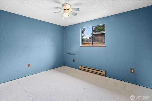 spare room featuring a baseboard radiator, a ceiling fan, and a textured ceiling
