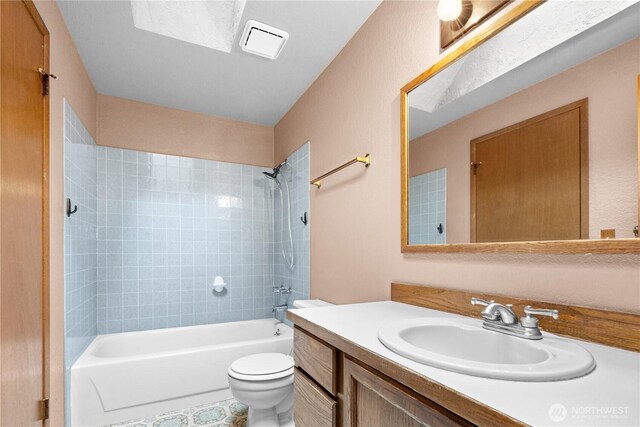 full bathroom featuring toilet, vanity, and bathing tub / shower combination