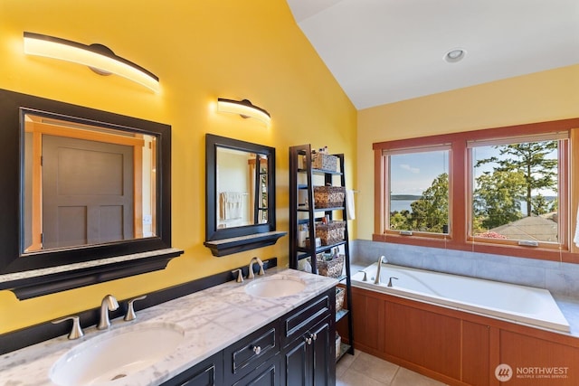 1433 Madison St, Port Townsend, WA 98368 - bathroom with double vanity, a garden tub, vaulted ceiling, and tile patterned floors