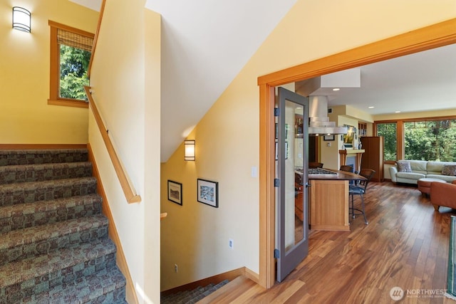 1433 Madison St, Port Townsend, WA 98368 - staircase with wood finished floors, baseboards, and recessed lighting