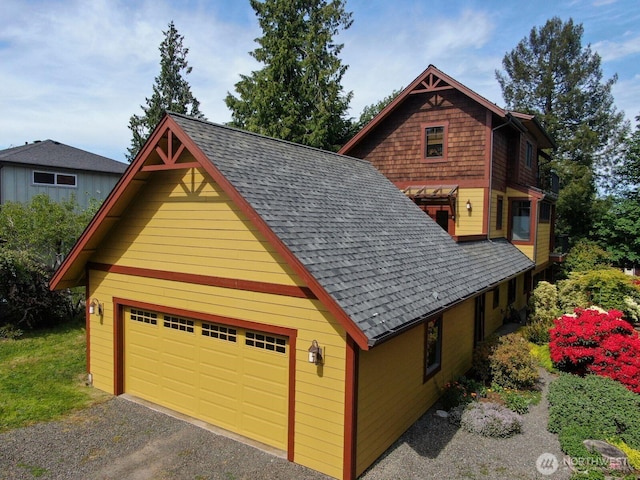 1433 Madison St, Port Townsend, WA 98368 - view of side of home with a garage and roof with shingles