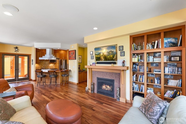 1433 Madison St, Port Townsend, WA 98368 - living room featuring wood finished floors, a fireplace, french doors, recessed lighting, and baseboards